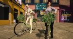 The Foragers pose with flower-decorated bicycles in front of the gallery.