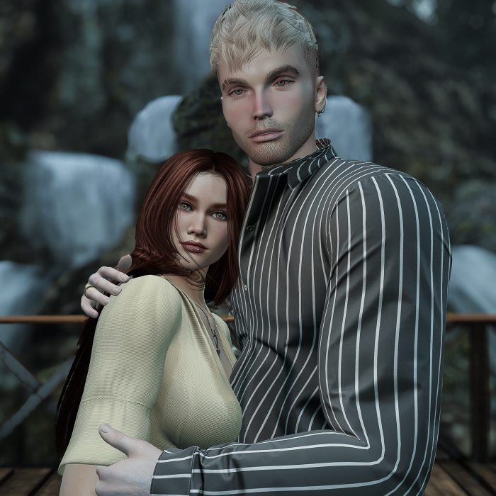 Close-up of the couple hugging in front of cascading waterfalls