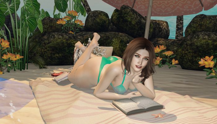 Woman reading a book while lying on her stomach, flowers in background.