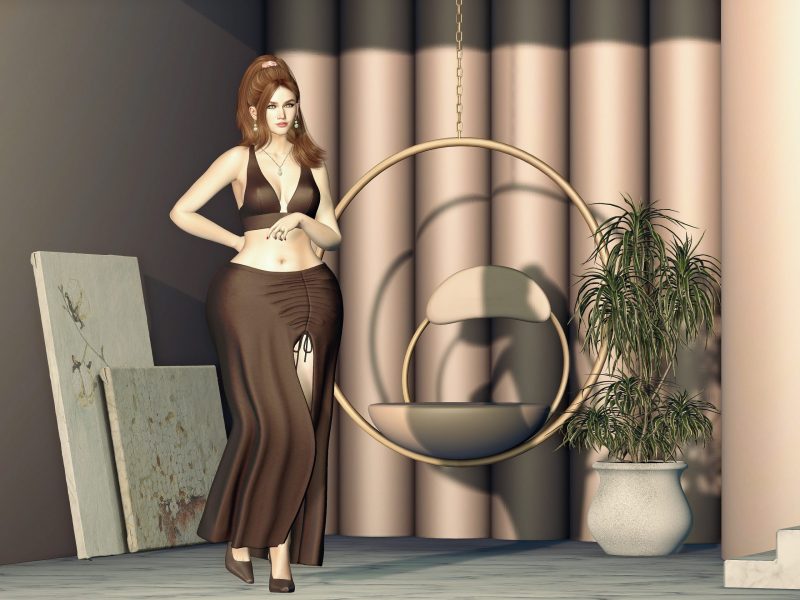Second Life fashion avatar wearing a brown crop top and slit skirt, standing confidently with hand on hip in front of a modern hanging chair and plant décor.