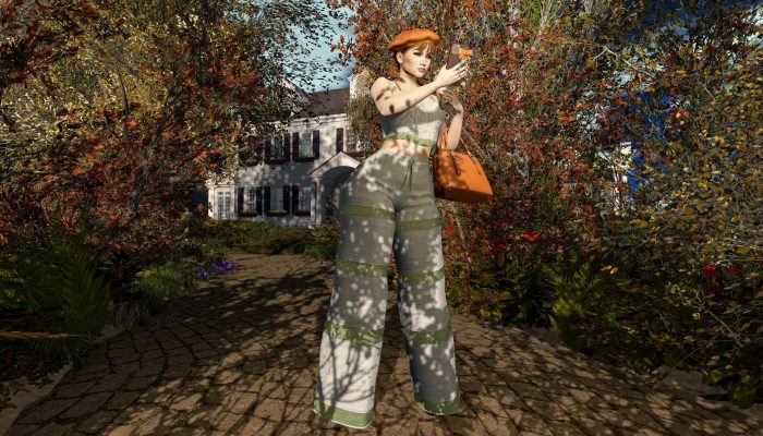 Woman taking a selfie in autumn outfit with beret and wide pants in Second Life.