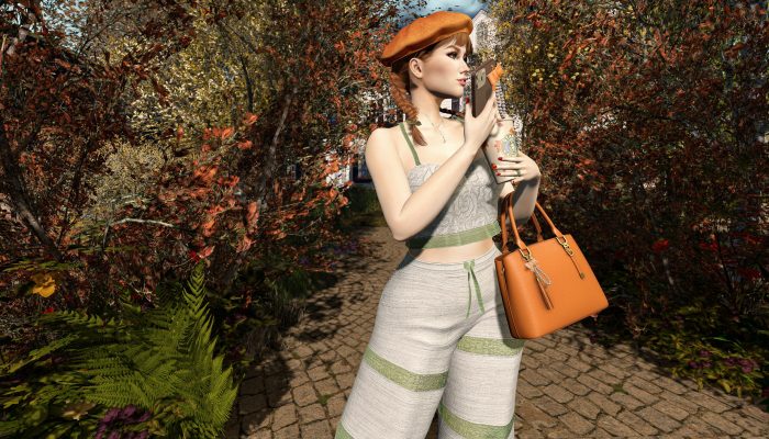 Side view of autumn outfit with crop top and pants, handbag and coffee in hand.