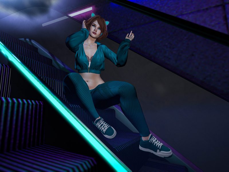 city streetwear fashion. Confident fashion pose under neon light in teal outfit.