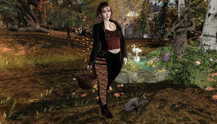 Avatar standing with fox in autumn forest, basket in hand, statue and swan pond in background – Second Life seasonal fashion