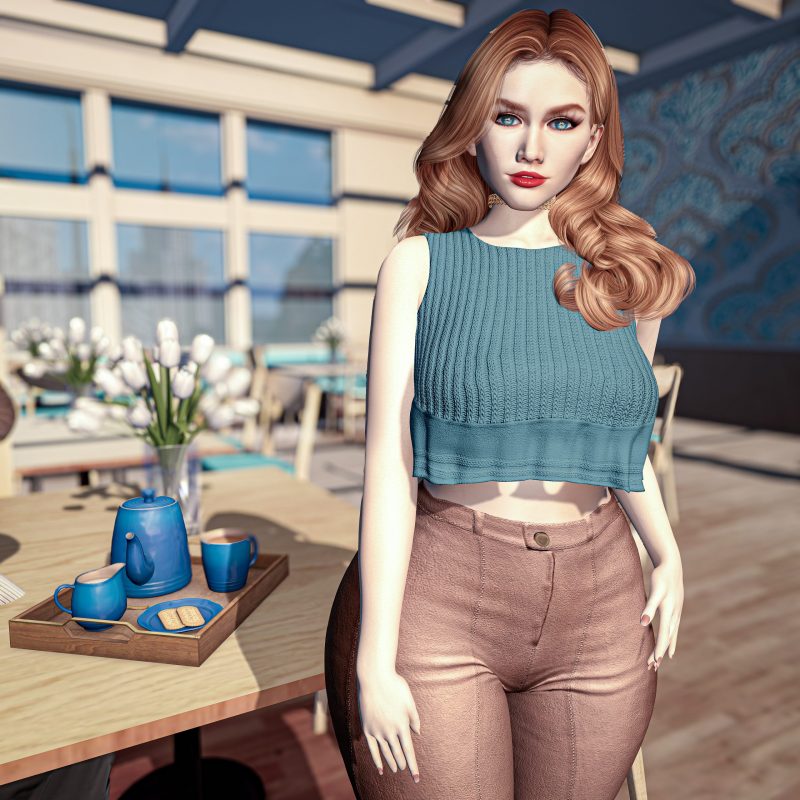 Blue teapot and cups on a tray, sunlight catching the porcelain beside her hand.